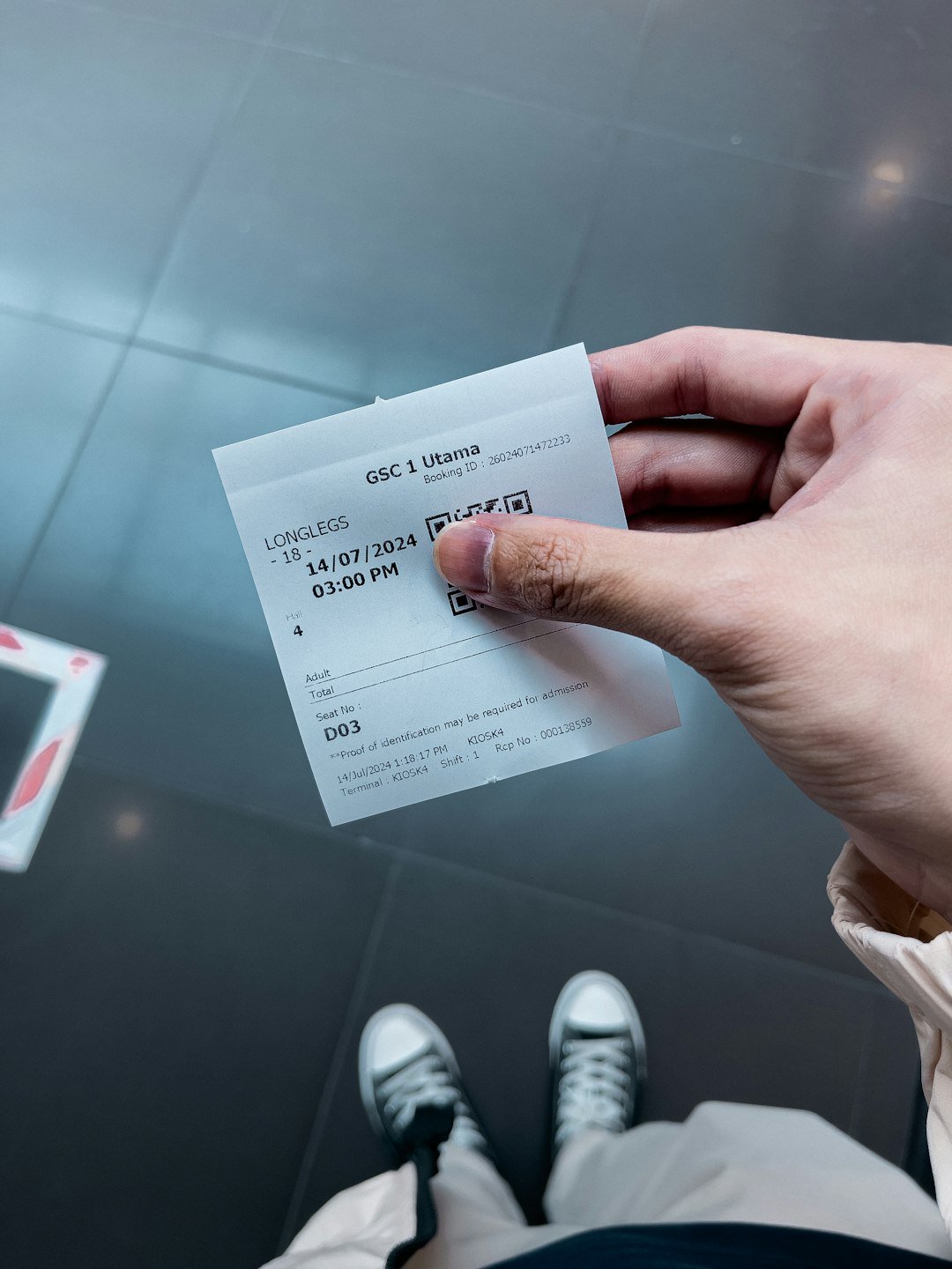 about-01 a-person-holding-a-ticket-in-their-hand-hqxf0kcxioo
